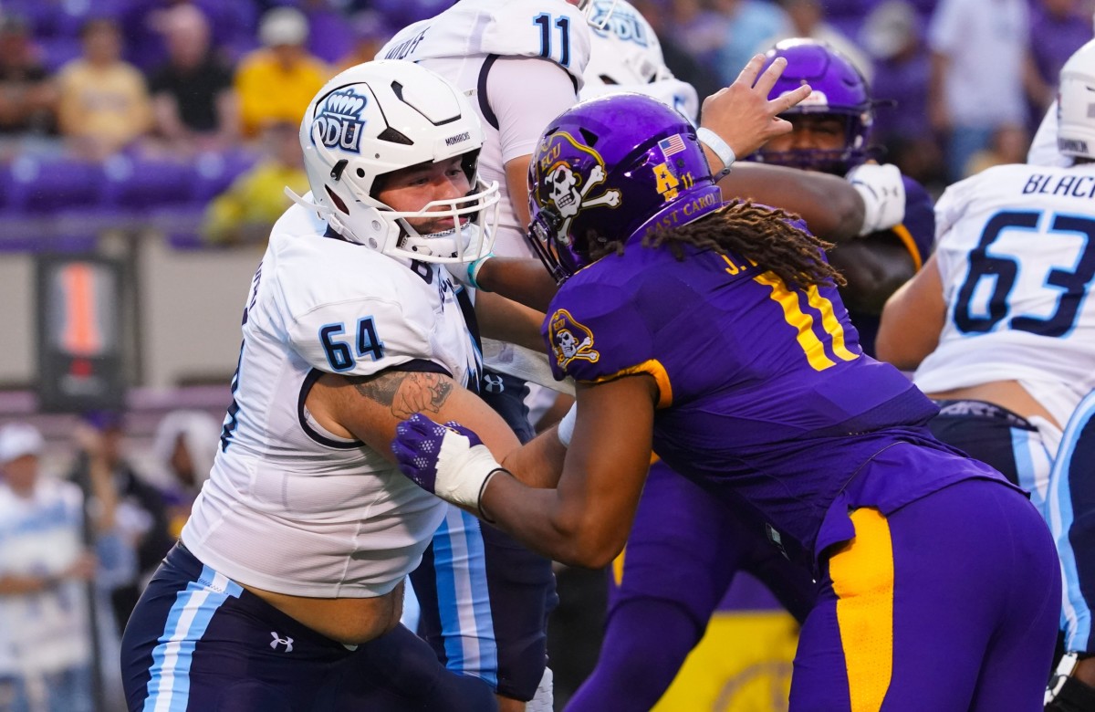 Sep 10, 2022; Old Dominion Monarchs offensive lineman Nick Saldiveri (64) blocks East Carolina Pirates linebacker Jeremy Lewis (11). Mandatory Credit: James Guillory-USA TODAY